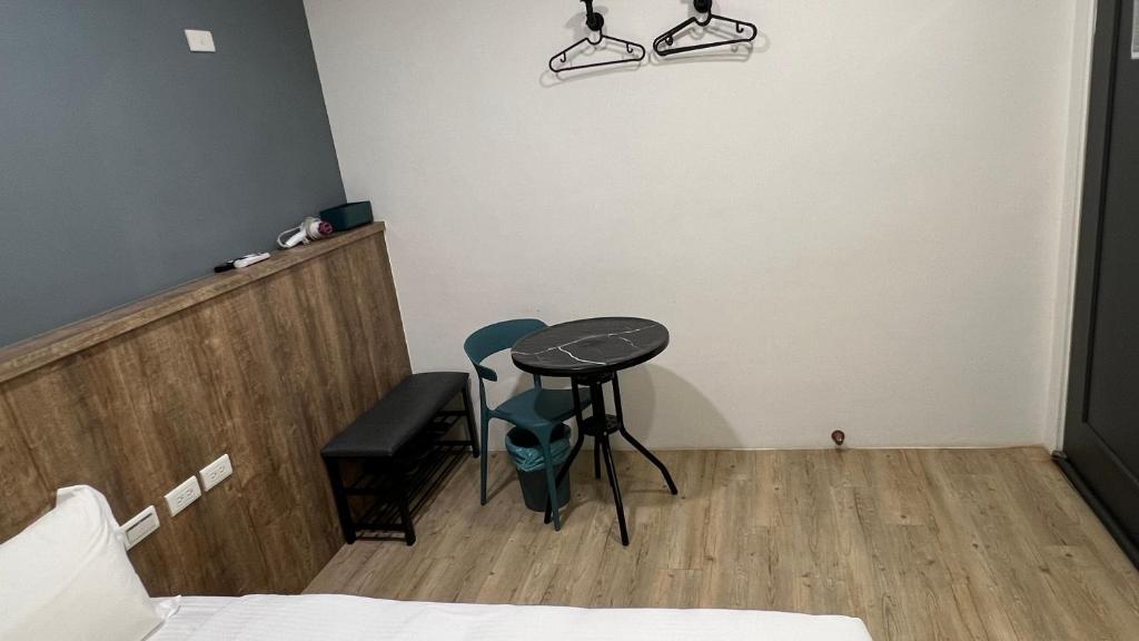 Postel nebo postele na pokoji v ubytování Benz 賓士溫泉旅館