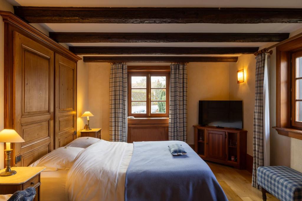 Postel nebo postele na pokoji v ubytování Hôtel à la Ferme
