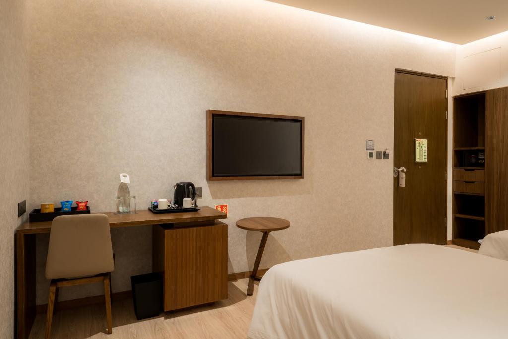 Postel nebo postele na pokoji v ubytování 080 Transit Hotel, T2