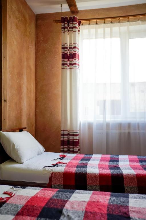 Postel nebo postele na pokoji v ubytování Готель Добрій