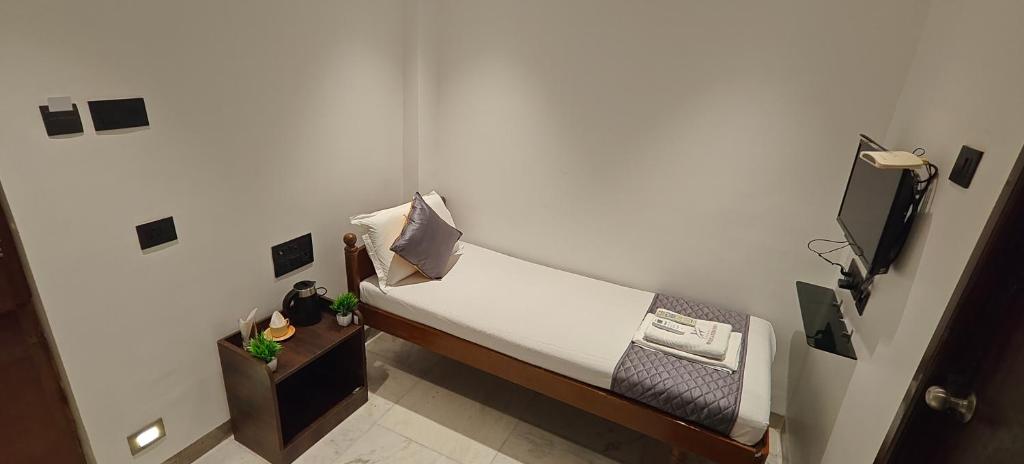 Postel nebo postele na pokoji v ubytování Woodlands Inn