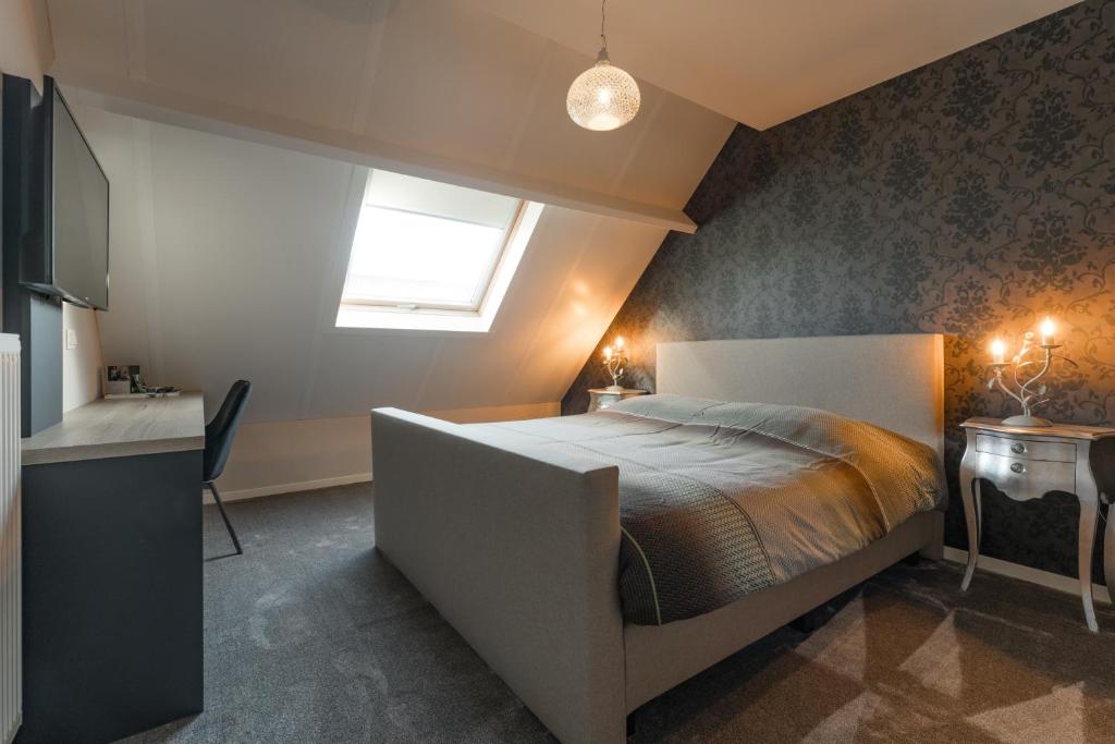 Postel nebo postele na pokoji v ubytování B&B De Floreffe