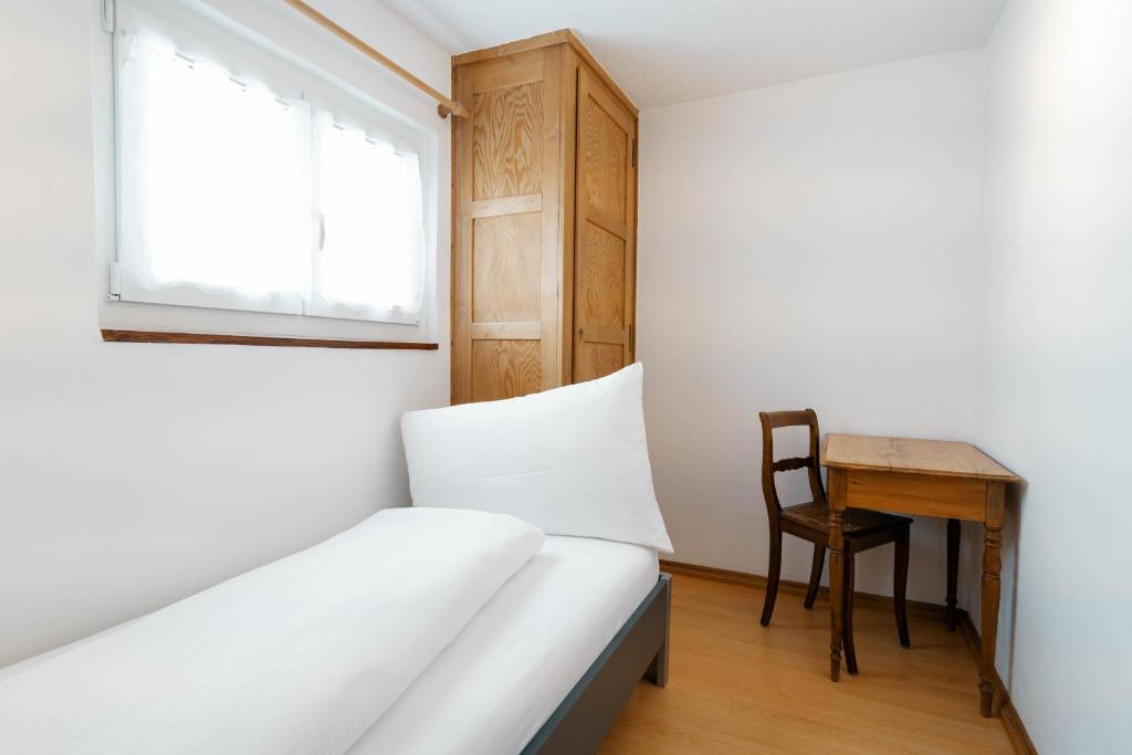 Postel nebo postele na pokoji v ubytování Apartment Raingüetli