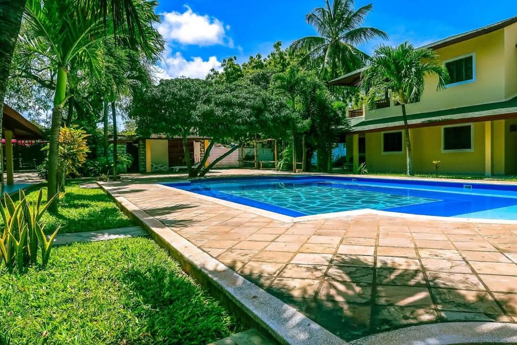 a swimming pool in the backyard of a house at Modern Girasoli Suites 01 in Malindi