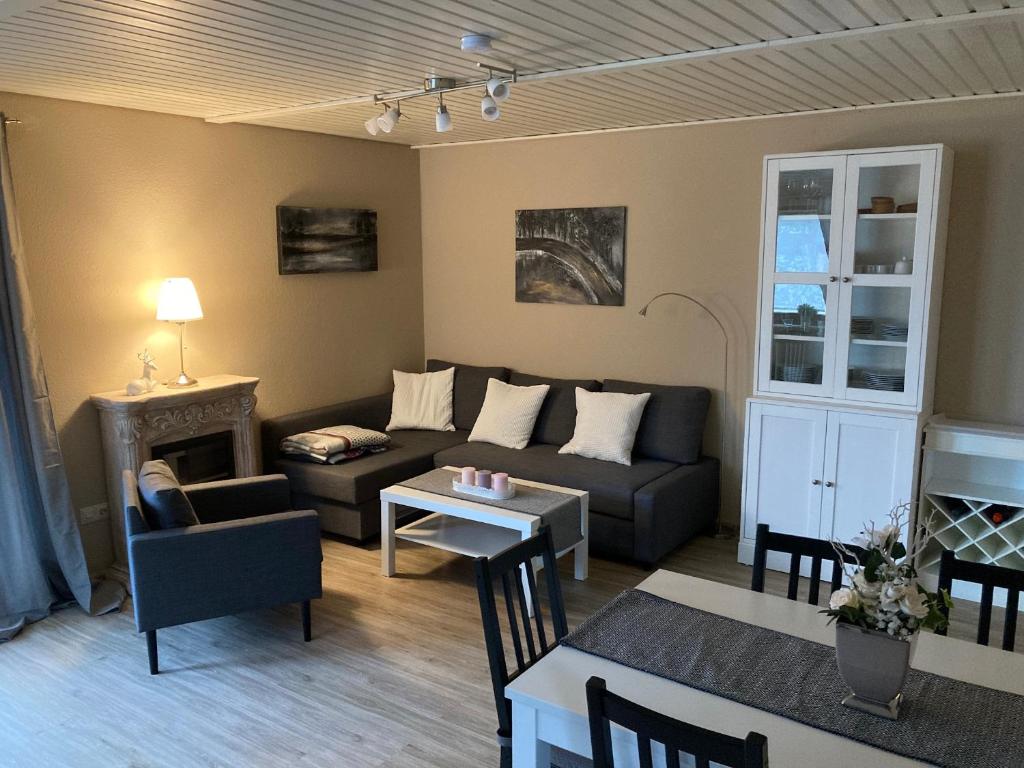 a living room with a couch and a table at Ferienwohnung Tannenhöh in Todtmoos