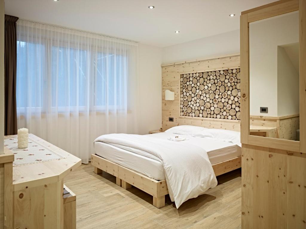 Postel nebo postele na pokoji v ubytování B&B Augusto
