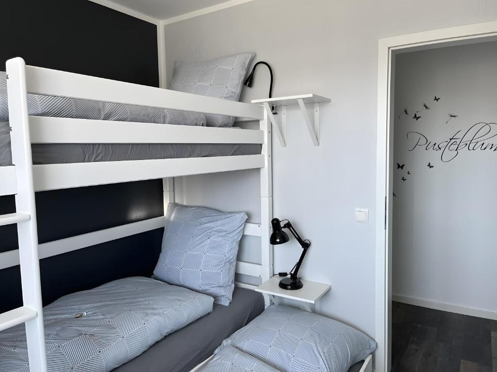 Postel nebo postele na pokoji v ubytování Haus Blumenglück