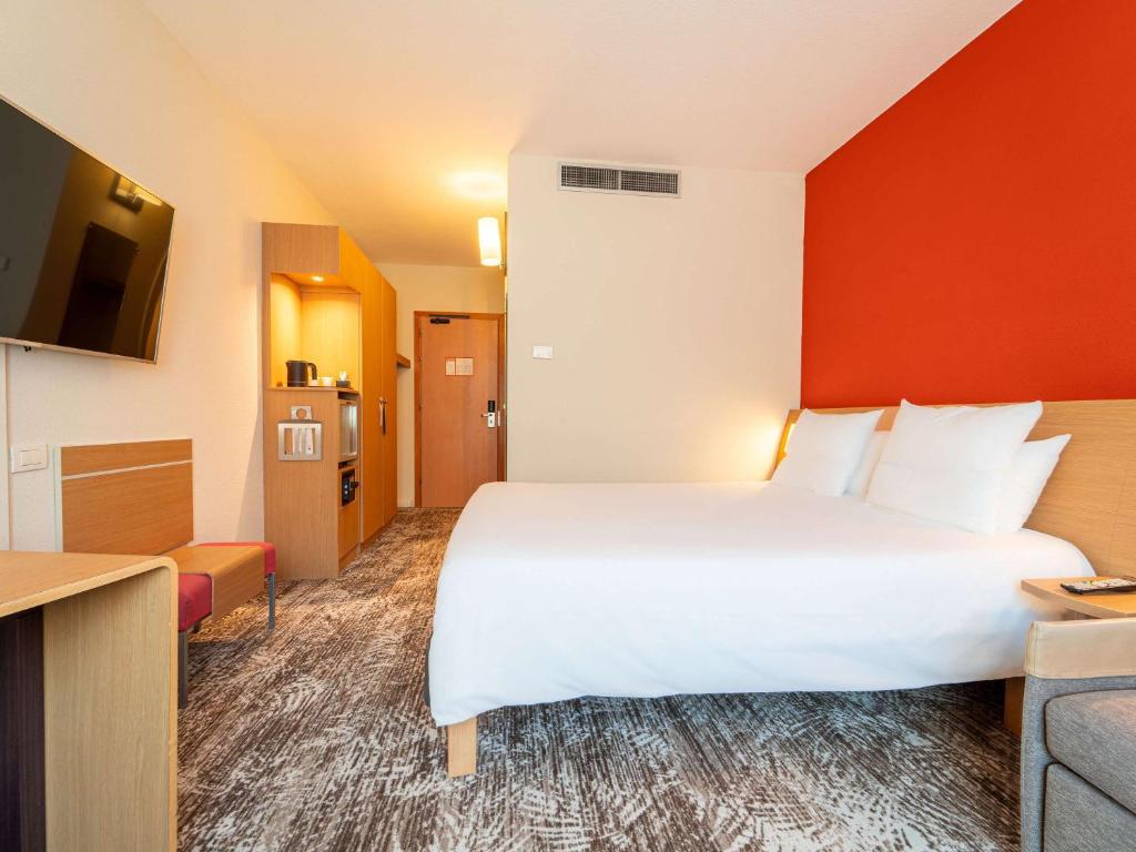 Postel nebo postele na pokoji v ubytování Novotel Roma Est