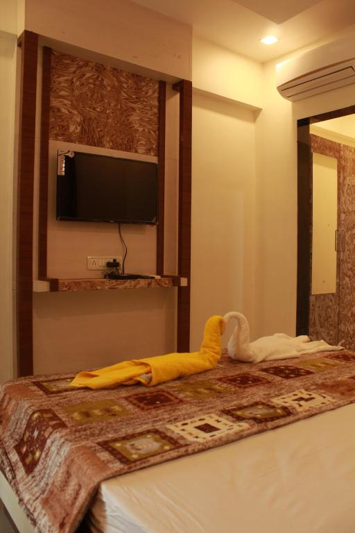 Postel nebo postele na pokoji v ubytování Hotel Skylark