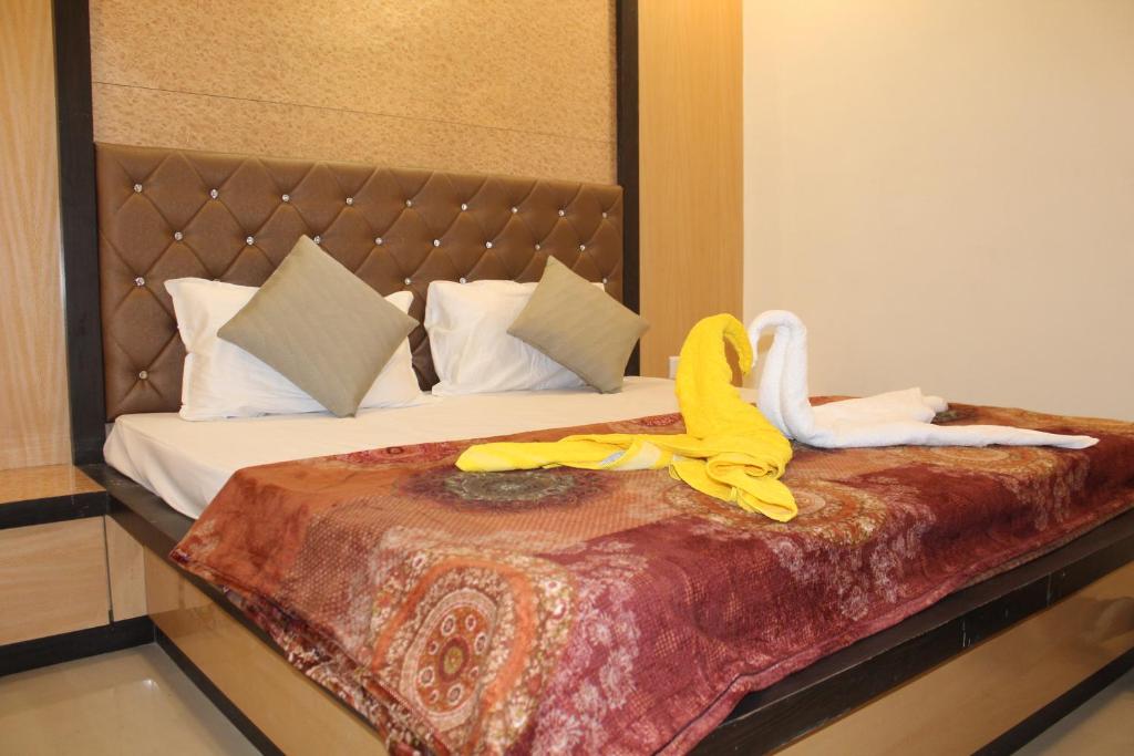 Postel nebo postele na pokoji v ubytování Hotel Skylark
