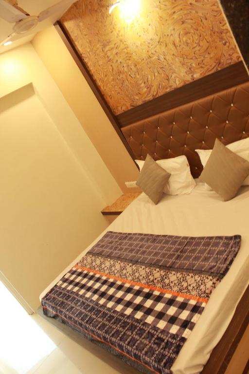 Postel nebo postele na pokoji v ubytování Hotel Skylark