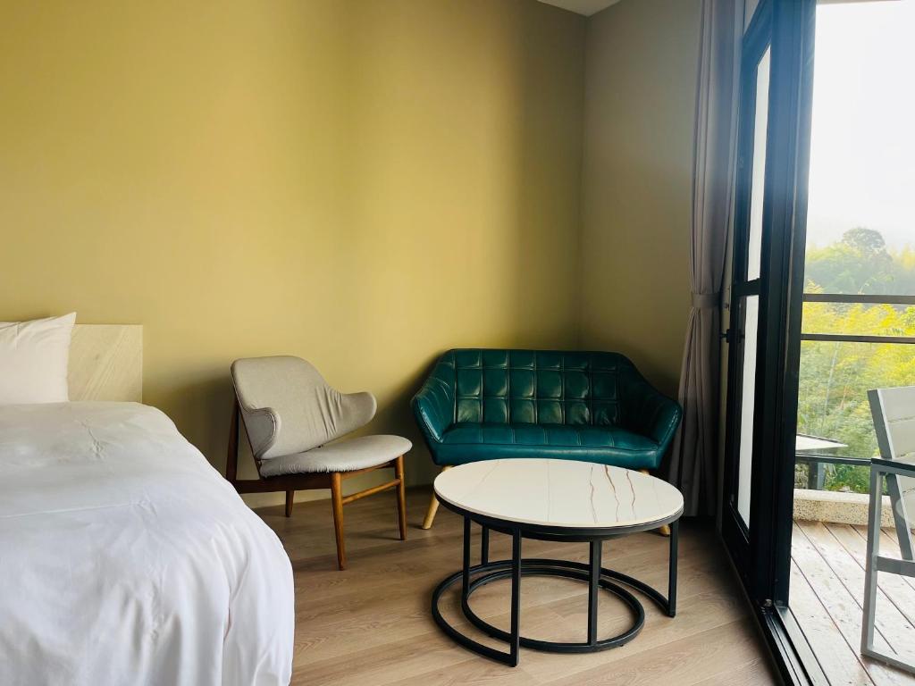 Postel nebo postele na pokoji v ubytování Xi Tou in Sunny Day Inn