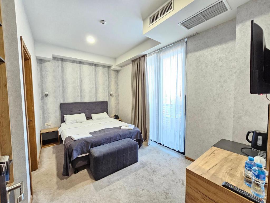 Postel nebo postele na pokoji v ubytování Hotel Flames