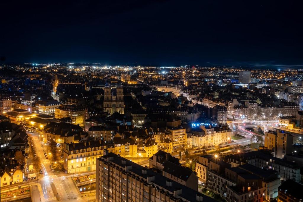 a view of a city at night at Vue imprenable - Garage privé in Rennes