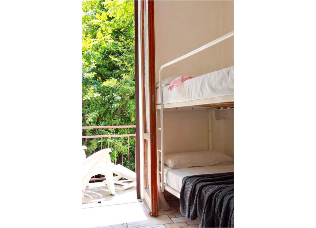 A bed or beds in a room at Casa Spiaggia