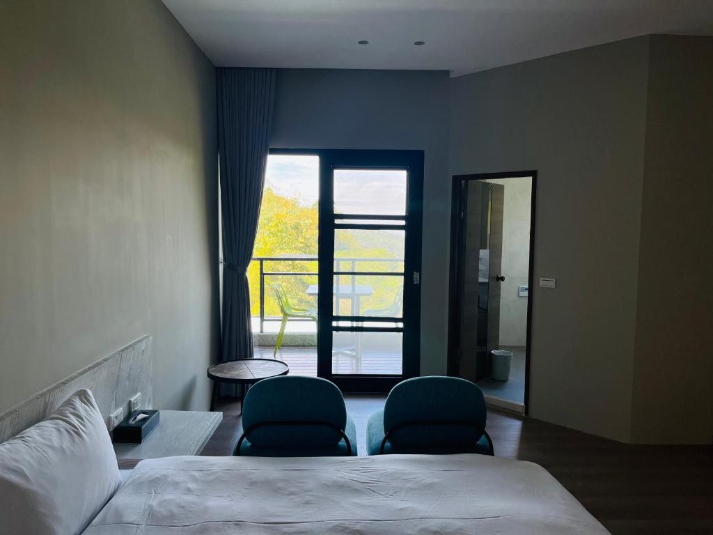 Postel nebo postele na pokoji v ubytování Xi Tou in Sunny Day Inn