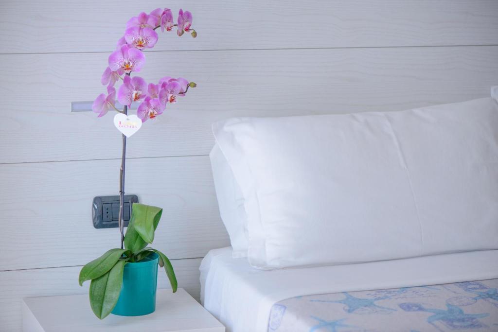 Postel nebo postele na pokoji v ubytování Hotel Sans Souci