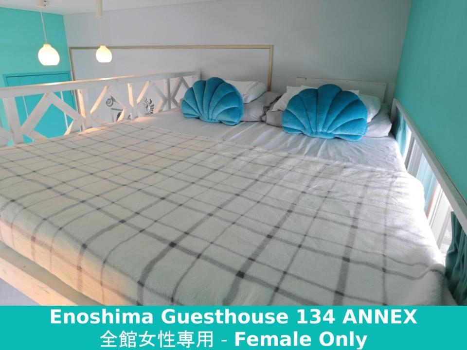 Postel nebo postele na pokoji v ubytování Enoshima Guest House 134