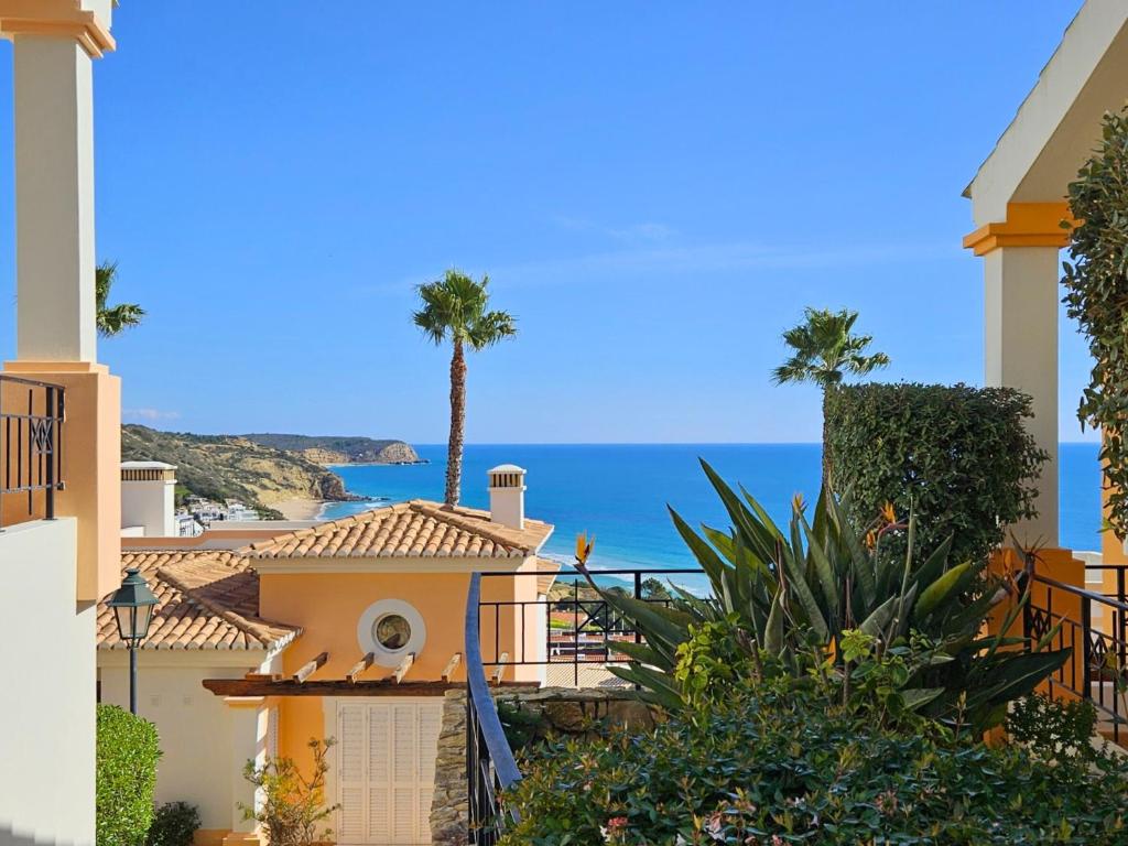 a view of the ocean from a house at The View – Santo António Villas, Golf & Spa in Salema