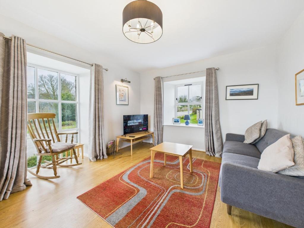 a living room with a couch and a table at Tollymore Forest family house Mourne Mountains in Bryansford