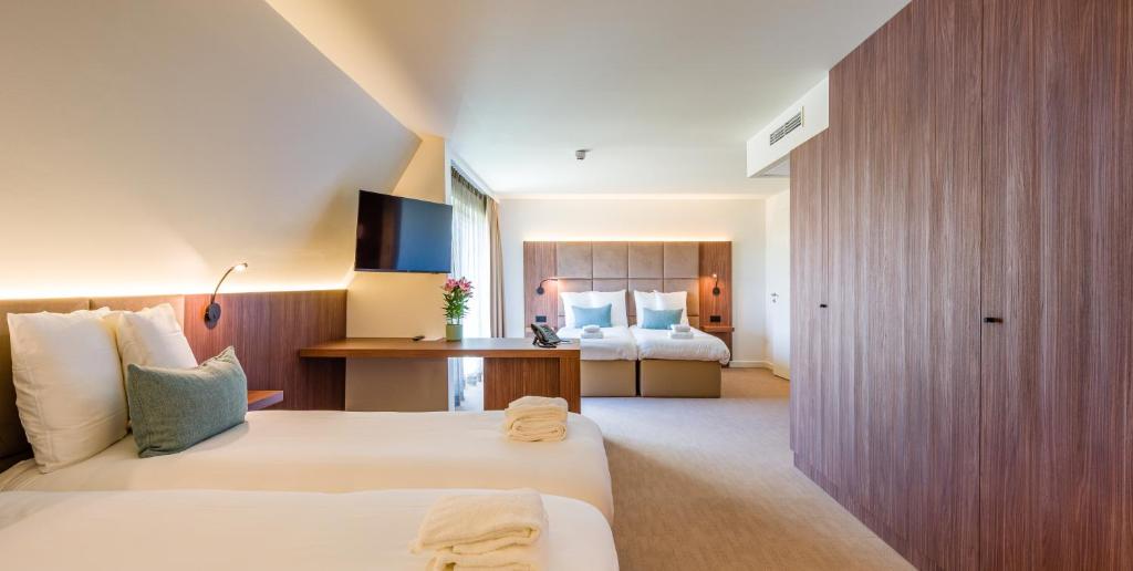 Postel nebo postele na pokoji v ubytování Dune Hotel Nieuwpoort