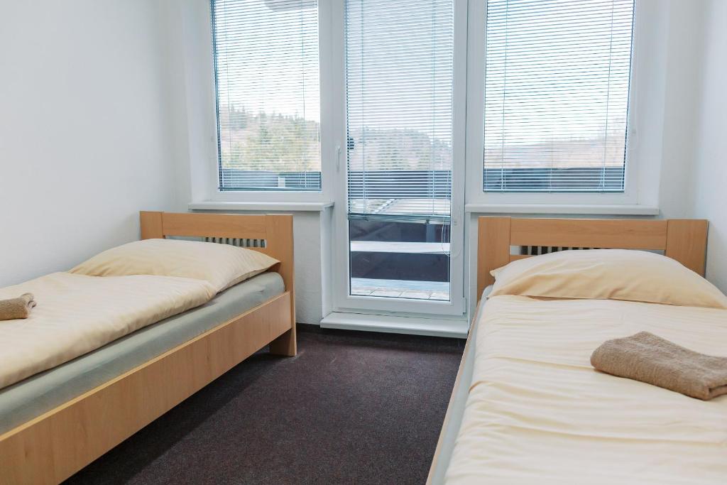 Postel nebo postele na pokoji v ubytování Turistická ubytovňa Zuberec pod Grápou