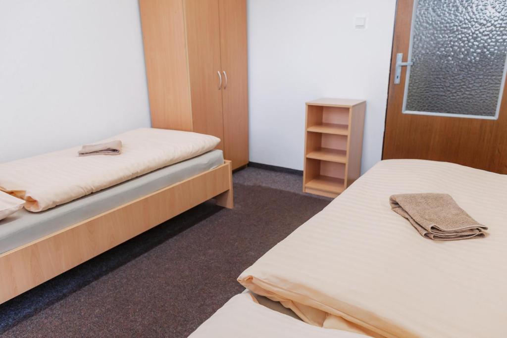 Postel nebo postele na pokoji v ubytování Turistická ubytovňa Zuberec pod Grápou