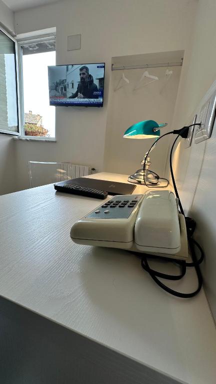 TV a/nebo společenská místnost v ubytování Albergo Hotel Raffaello