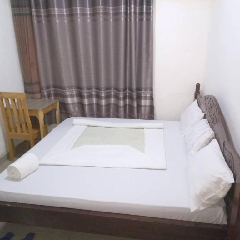 Ένα ή περισσότερα κρεβάτια σε δωμάτιο στο Angelina guest house