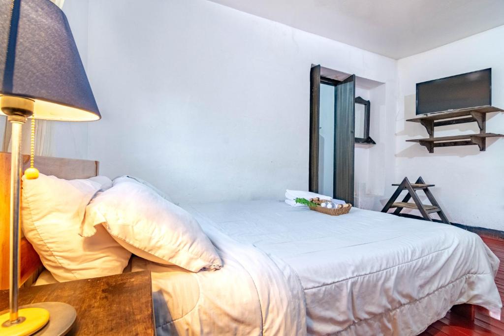 Ένα ή περισσότερα κρεβάτια σε δωμάτιο στο Hotel Casa del Colibri