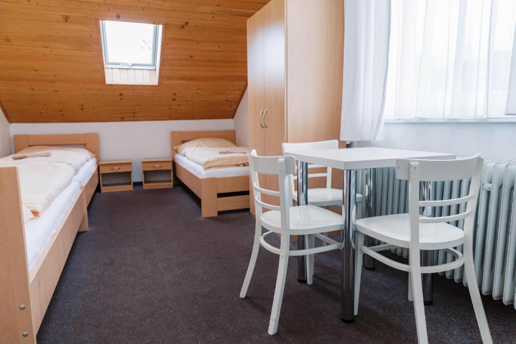 Postel nebo postele na pokoji v ubytování Turistická ubytovňa Zuberec pod Grápou