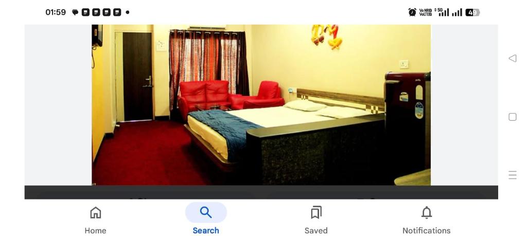 Giường trong phòng chung tại SMS GRAND inn