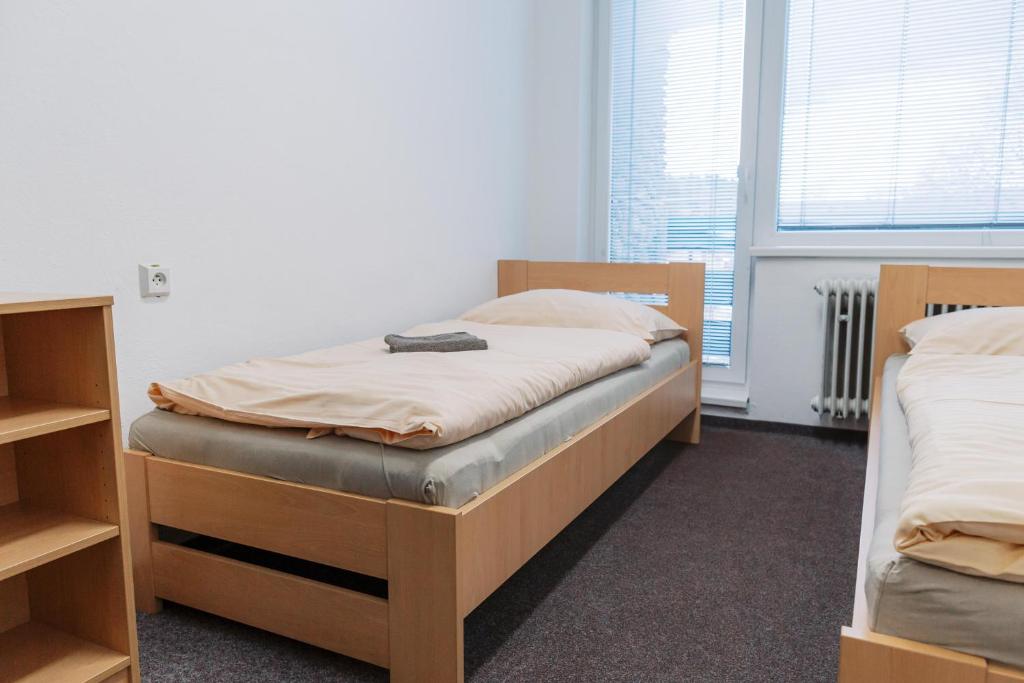 Postel nebo postele na pokoji v ubytování Turistická ubytovňa Zuberec pod Grápou