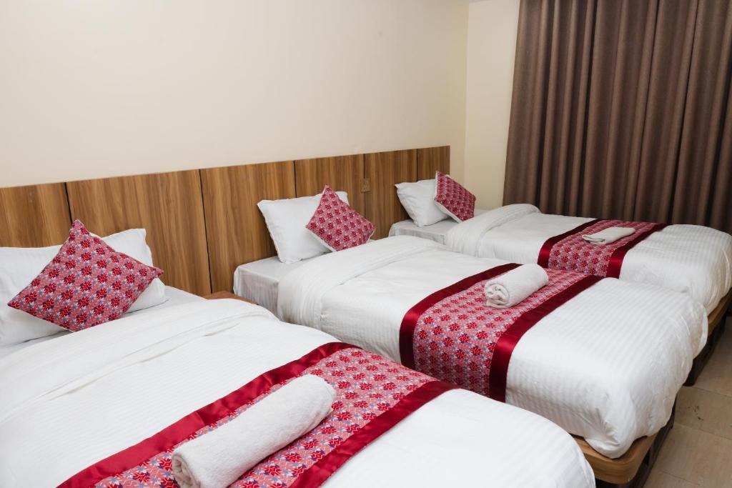 Postel nebo postele na pokoji v ubytování Rightway Hotel & Restaurant