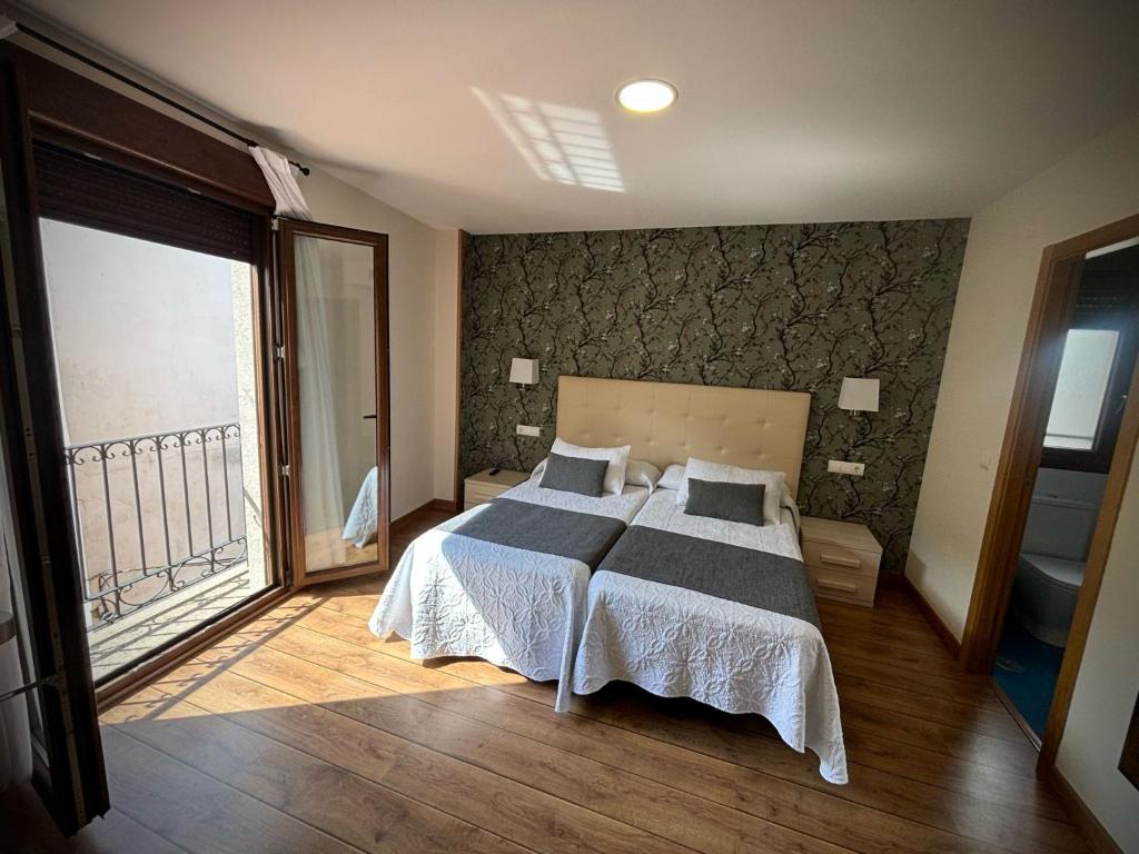 Postel nebo postele na pokoji v ubytování Hotel Molina Real