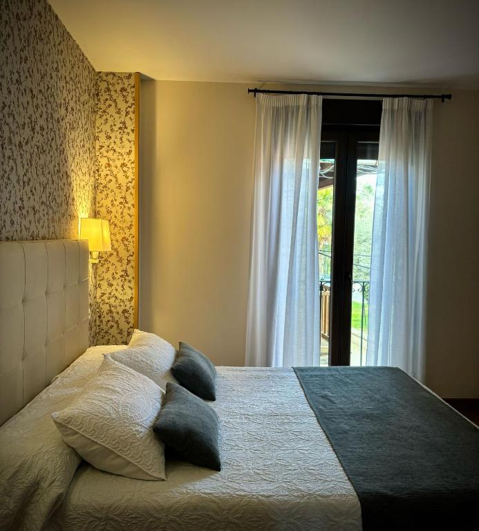 Postel nebo postele na pokoji v ubytování Hotel Molina Real