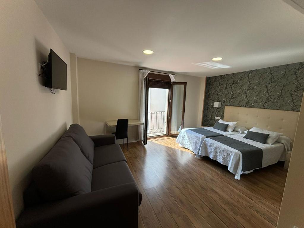 Postel nebo postele na pokoji v ubytování Hotel Molina Real