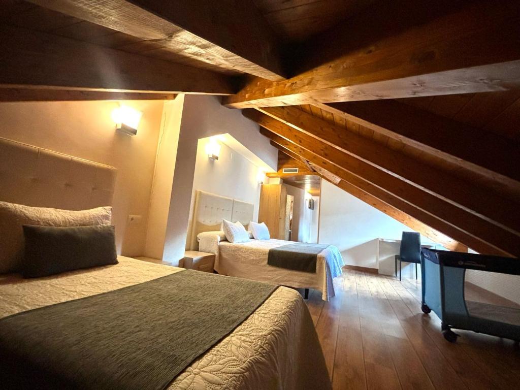 Postel nebo postele na pokoji v ubytování Hotel Molina Real