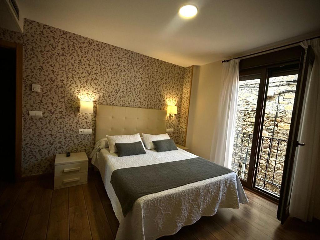 Postel nebo postele na pokoji v ubytování Hotel Molina Real