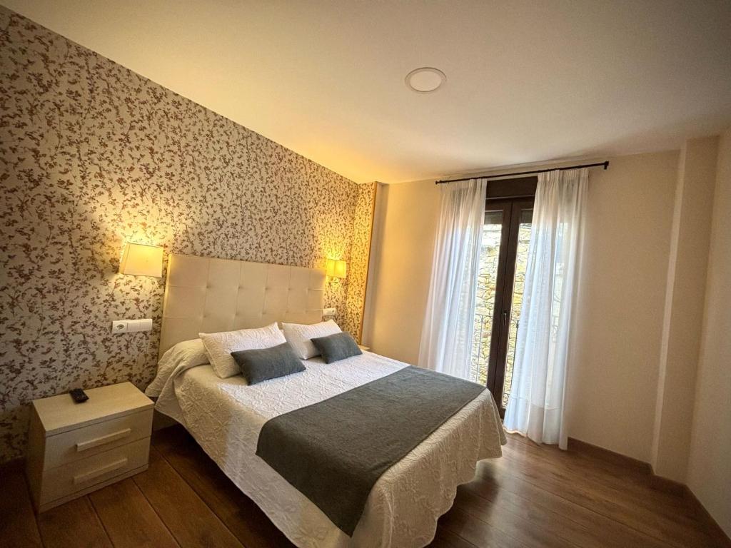 Postel nebo postele na pokoji v ubytování Hotel Molina Real