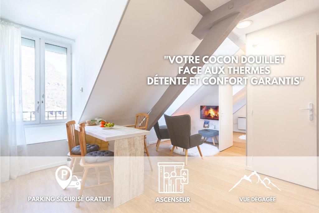 une salle à manger avec une table et une cheminée dans l'établissement Le Perchoir, avec parking, face aux Thermes, à Luchon