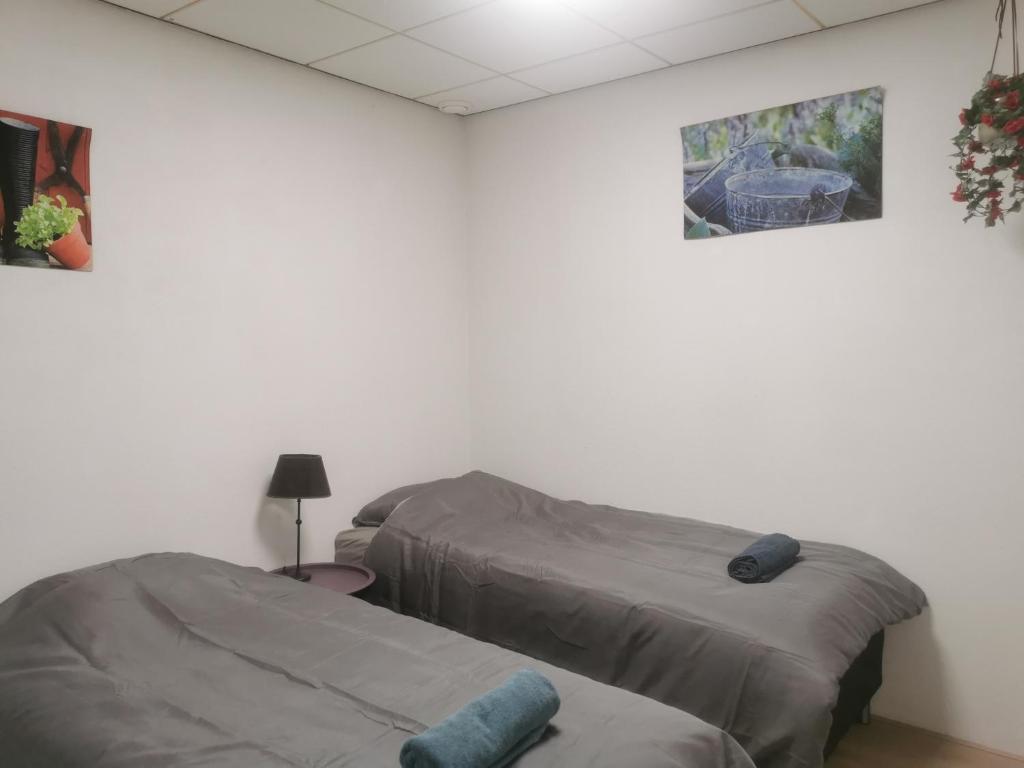 Postel nebo postele na pokoji v ubytování Dorpszicht Yerseke centrum