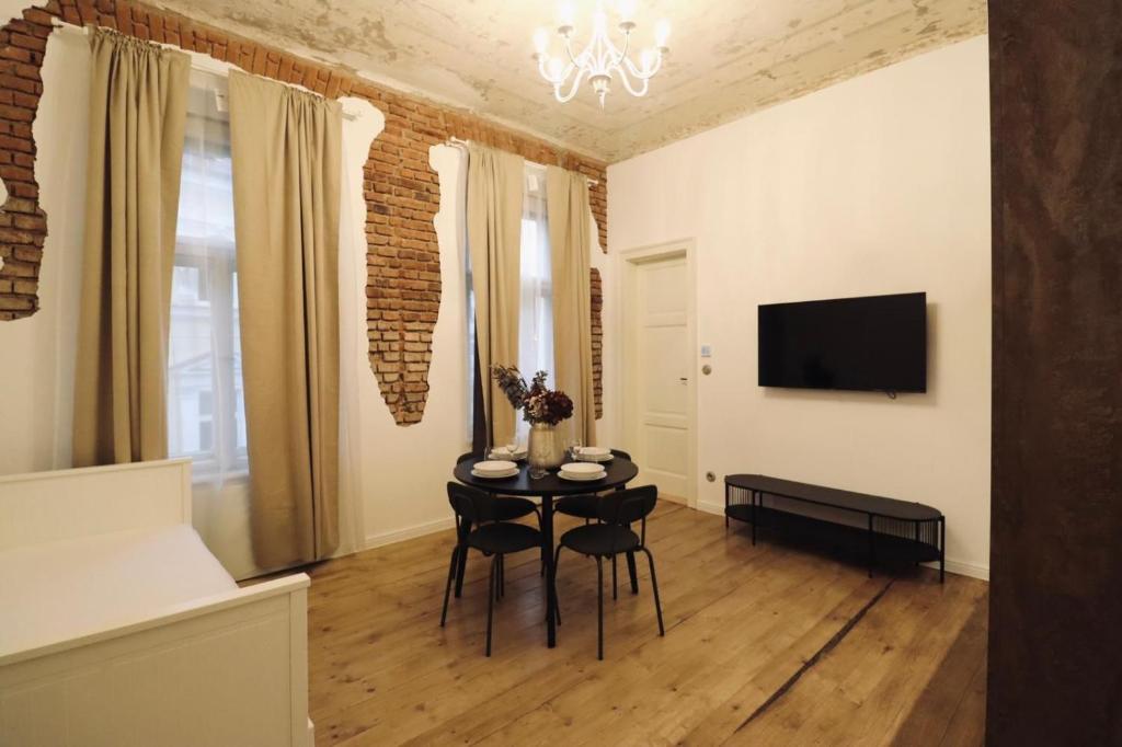 TV a/nebo společenská místnost v ubytování Vila Notre-Dame