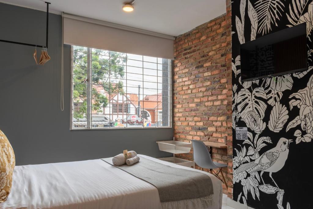 Postel nebo postele na pokoji v ubytování Nomadia Coliving Boutique