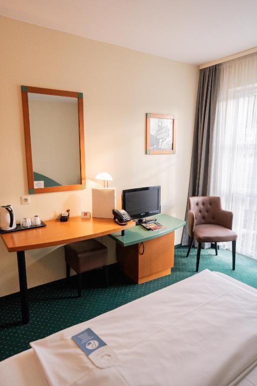 Postel nebo postele na pokoji v ubytování Trip Inn Hotel Dasing-Augsburg
