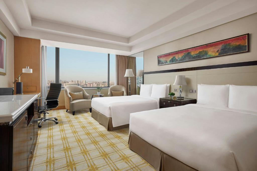 Postel nebo postele na pokoji v ubytování JW Marriott Hotel Beijing