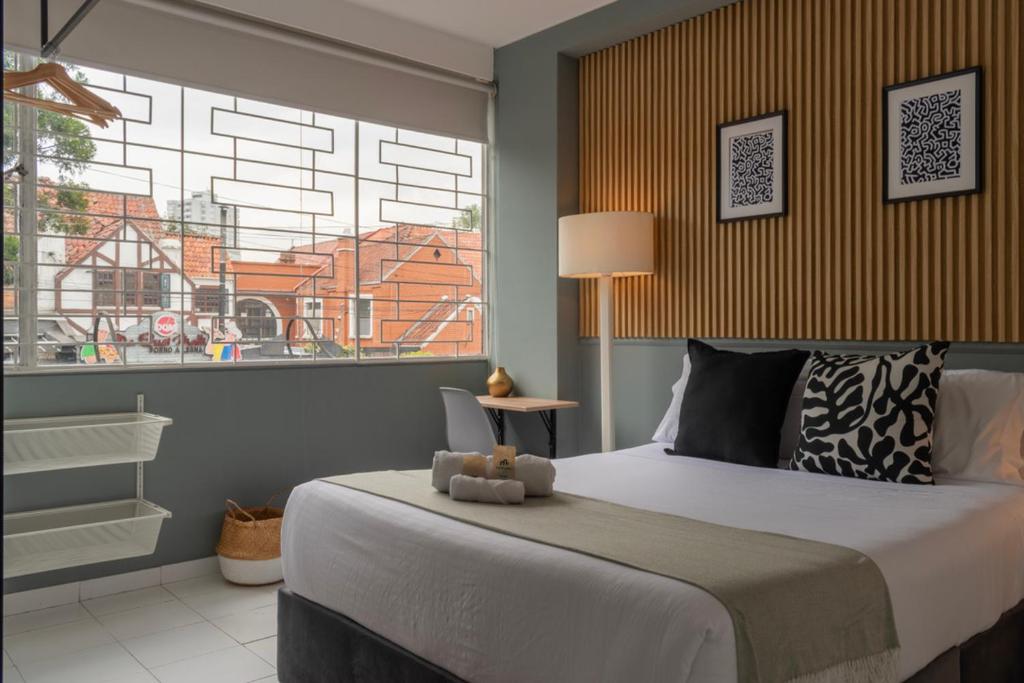 Postel nebo postele na pokoji v ubytování Nomadia Coliving Boutique