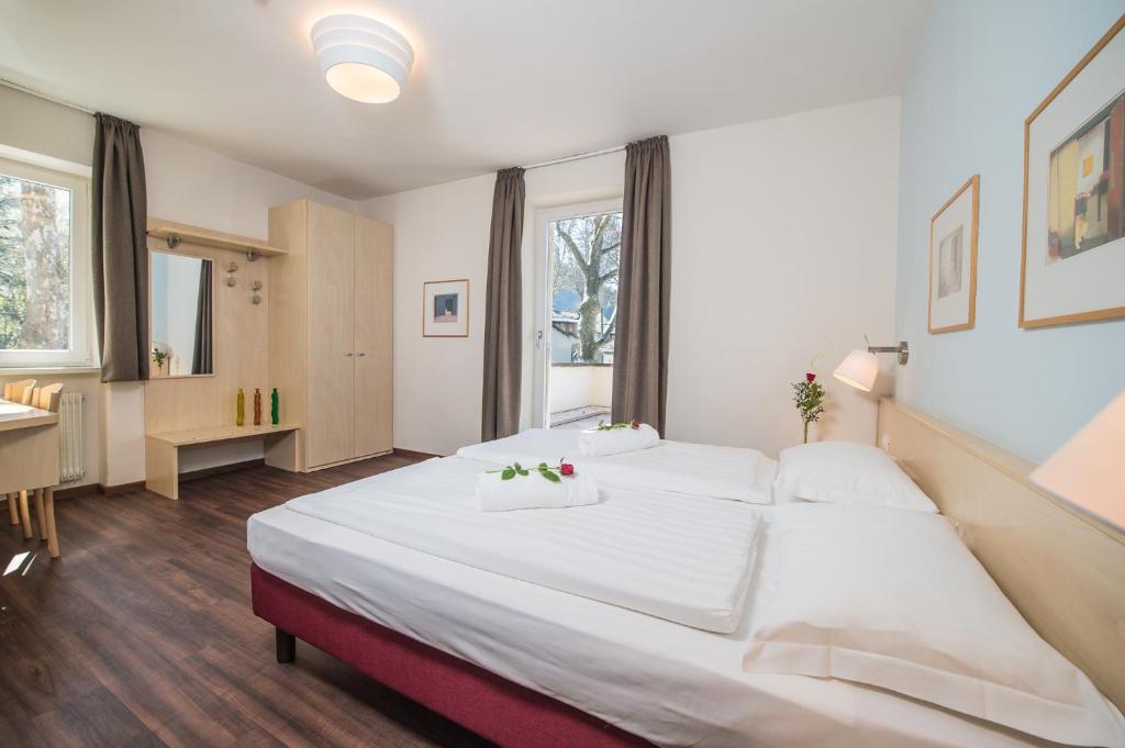 Postel nebo postele na pokoji v ubytování Hotel Heide Park