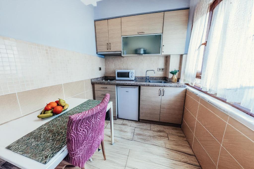 Kuchyň nebo kuchyňský kout v ubytování Olive Garden Apart