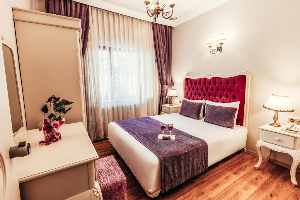 Postel nebo postele na pokoji v ubytování Olive Garden Apart